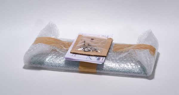 The precision cut acrylic panels,  screws, and assembly instructions are packed in bubblewrap.