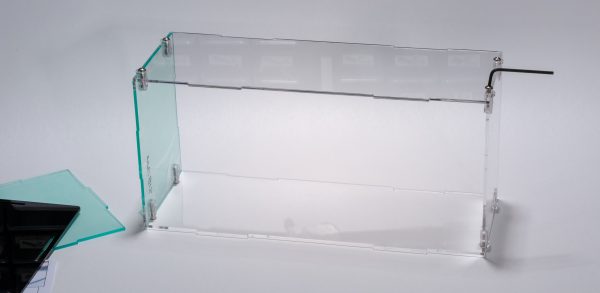 I found it easier to tighten the screws by removing the frame from its base.