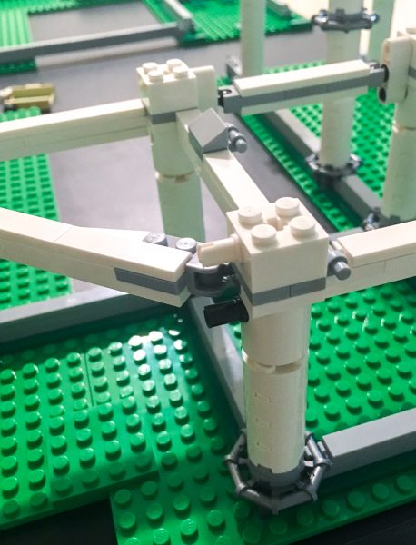 Beams support the tracks, while making it rigid enough to carry.