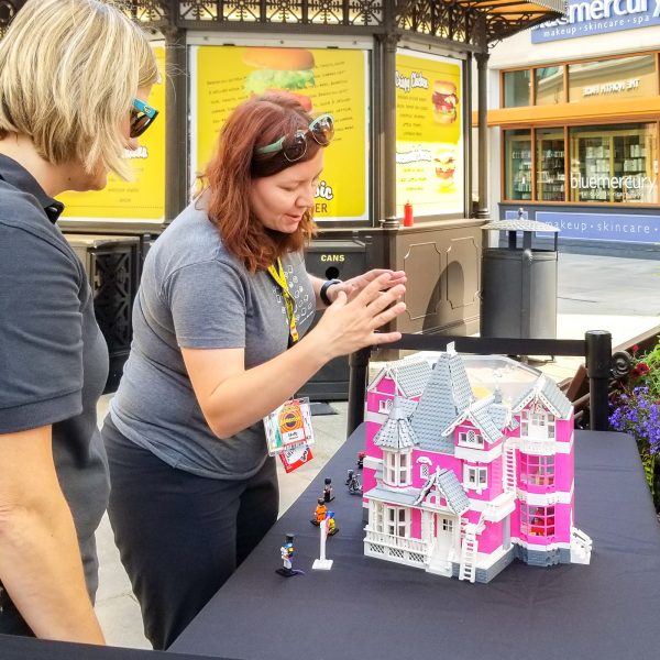 Holly Webster showing off her Coraline House at a LEGO fan event. (Photo: Jeannie Jonas)