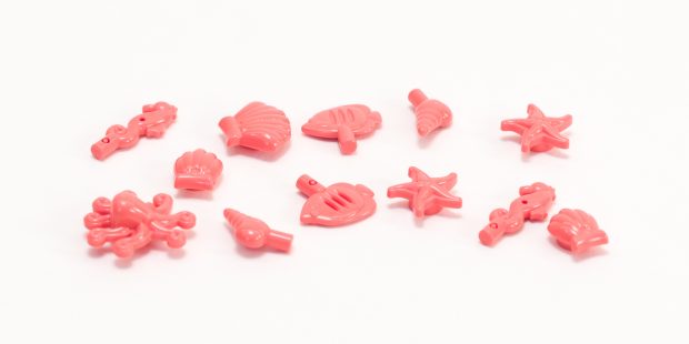 It also includes a bag of fish and shells in the same Vibrant Coral color.