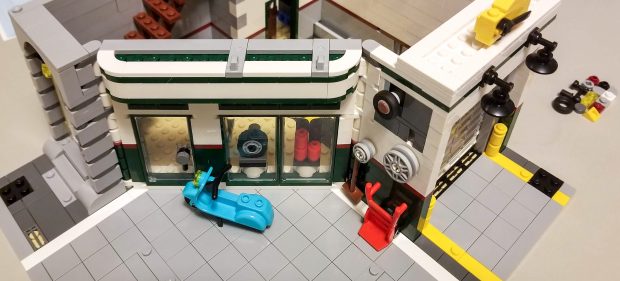 Rotate the tire on the upper-left hand side of the garage to open it.