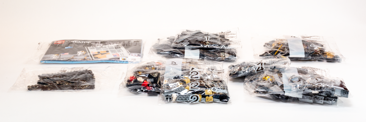 There are numbered bags corresponding to the four stages of the build process.