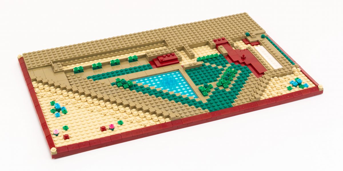 By Step 26, we have completed the landscaping and created a foundation for the building.