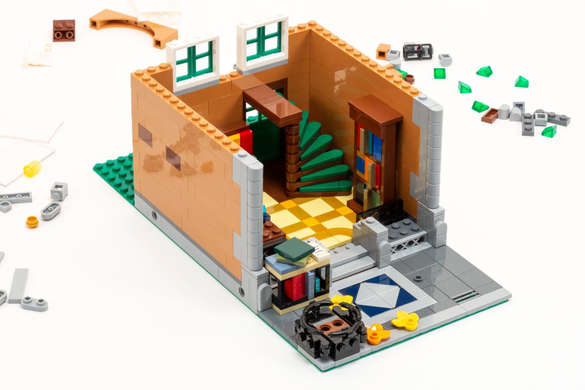 Interior includes a beautiful spiral staircase, bookshelves, and other intricate details.