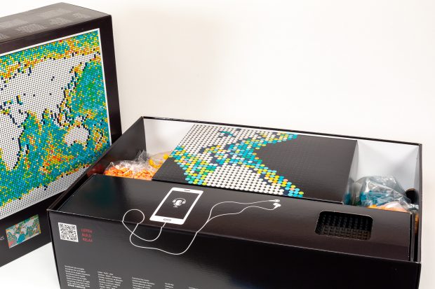 The box contains two smaller boxes, plus many bags of round plates and tiles.