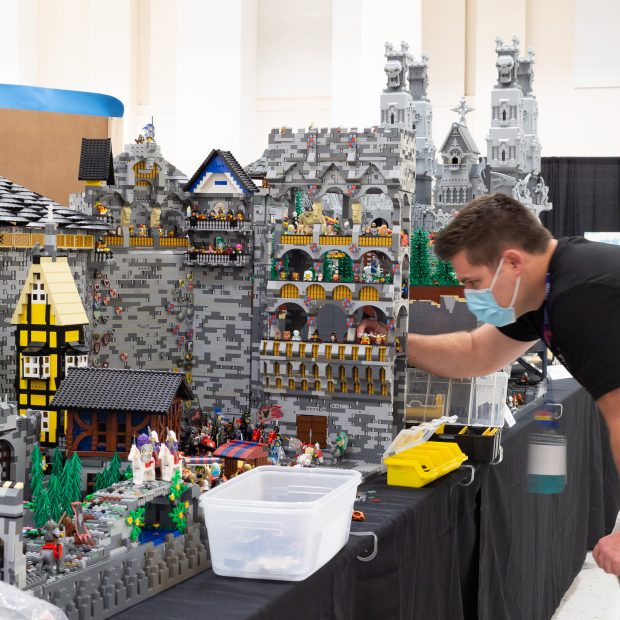 LEGO Artist putting the finishing touches on their model late into the evening.