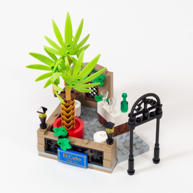 The tiny patio features a gorgeous palm tree.