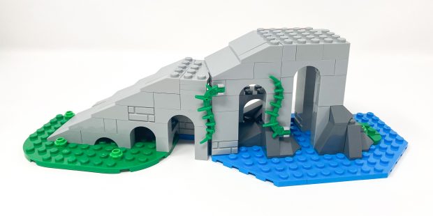 The ramp is partially submerged in water which contrasts the other half being in the dirt.