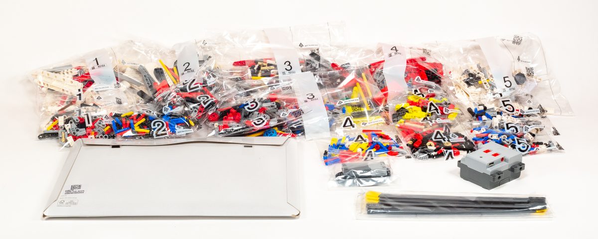 The build process takes place over five numbered stages.