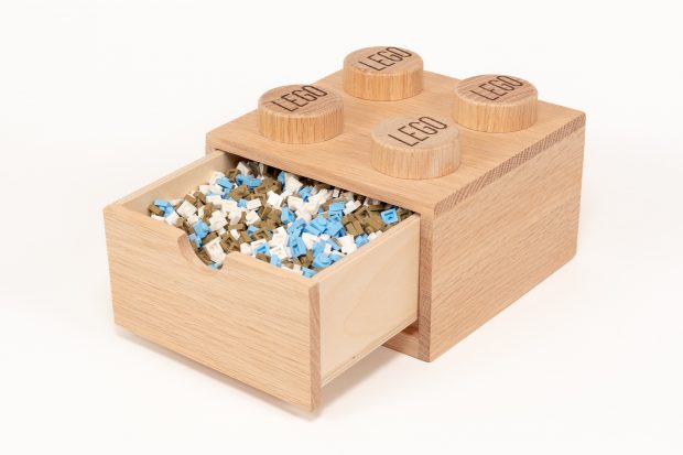 Measuring how many 1×1 Plates fit before they fall out of the notch on the front of the drawer.