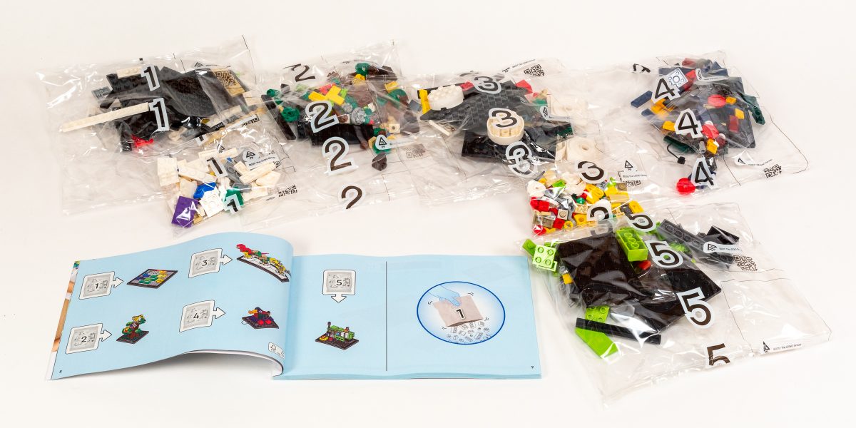 The box contains seven bags corresponding to five numbered stages.