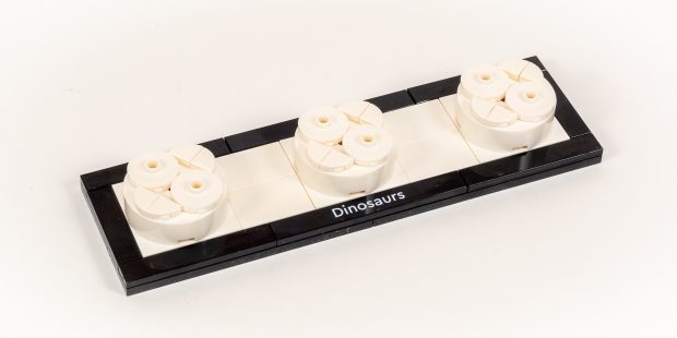 The base uses 4x4 turntables to position dinosaurs at an angle.