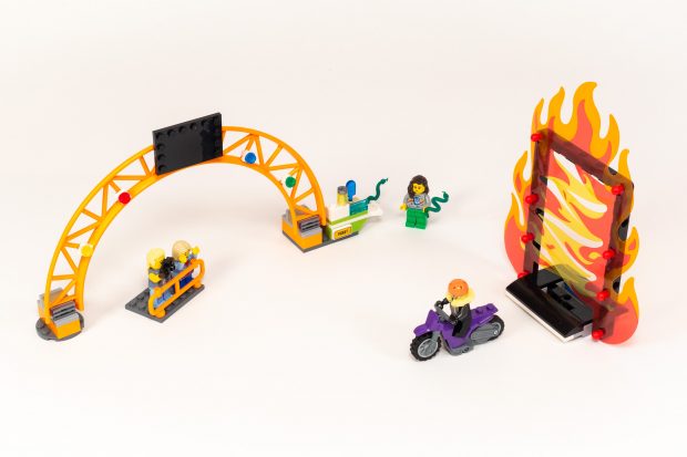 The archway, miniature stands, and a loop surrounded by flames.