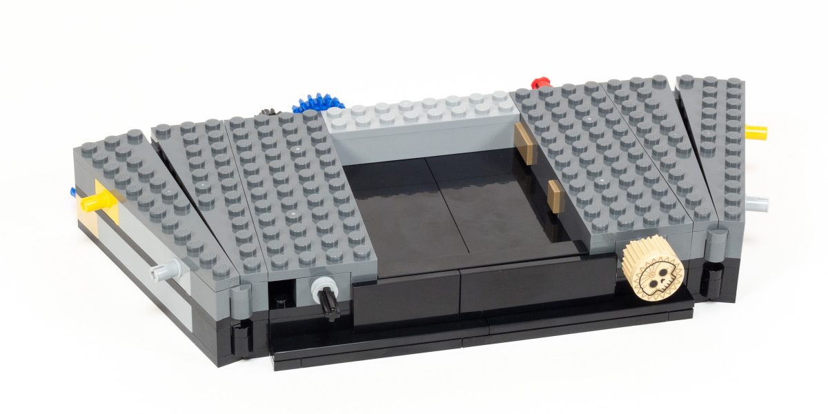 The central base has a black tile recess representing a deep pit.