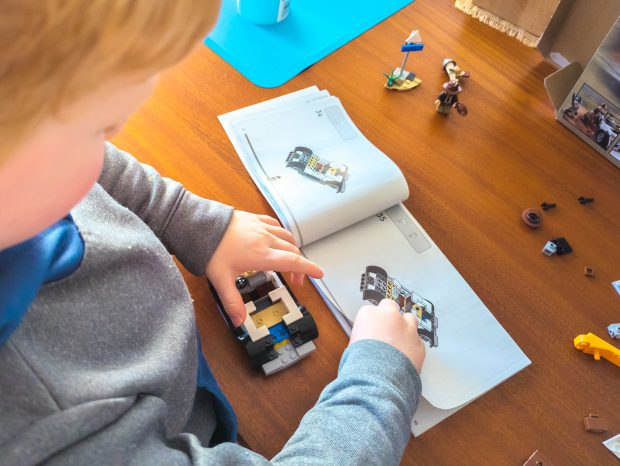 Building the car without much help from his dad.