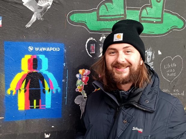 Street Artist WAWAPOD ( Warren Podguszer) with his minifigure-inspired art. (Photo: BrickNerd)