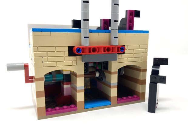 From the back you can see the mechanism in detail and see the action as you make the figures jump.