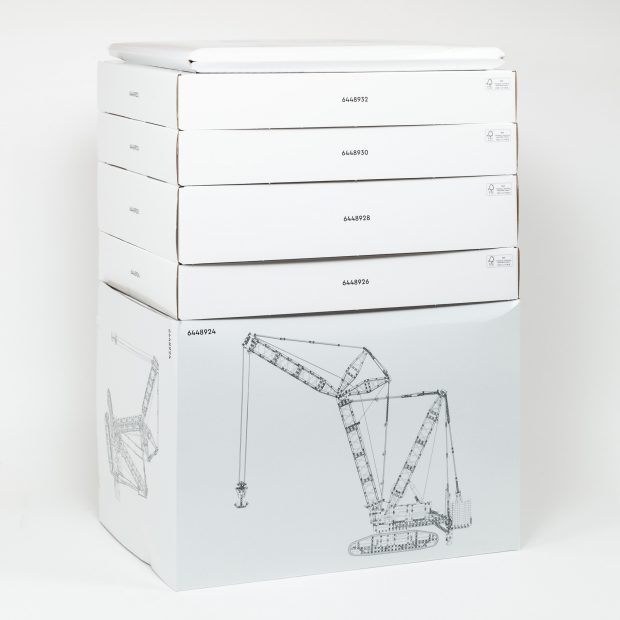 A cardboard pouch and five cardboard boxes try to keep things organized.