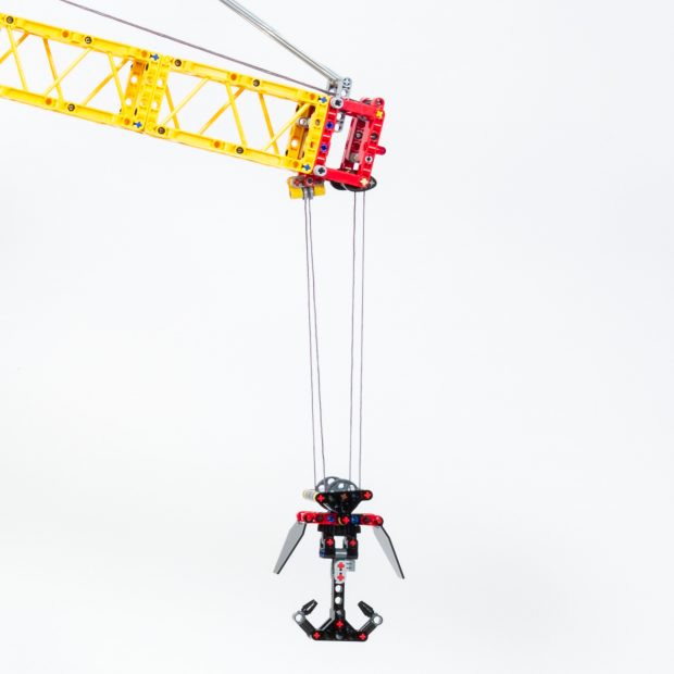 The hook is brick-built, but can not grab objects easily without assistance.
