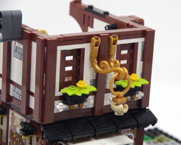 The golden ornamentation is regal, even if it does include a hot dog bun.