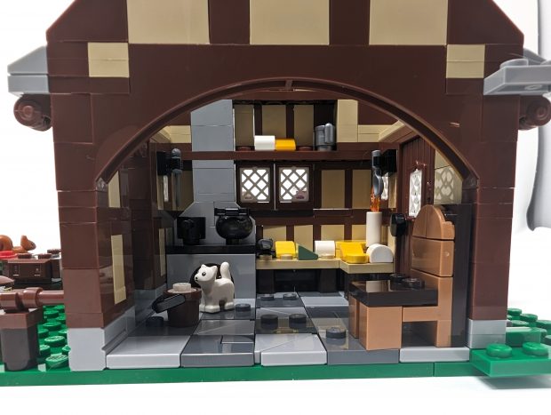 The included kitten keeps rodents away from the Cheese Factory.