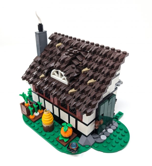 A variety of vegetables are grown alongside the farm house.