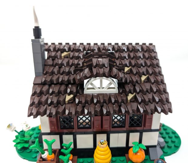 Layered roofing technique using claws are used to get a thatched roof effect.