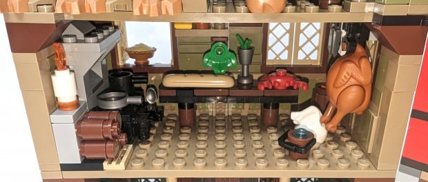 The kitchen is packed to the brim with equipment, utensils and even food.