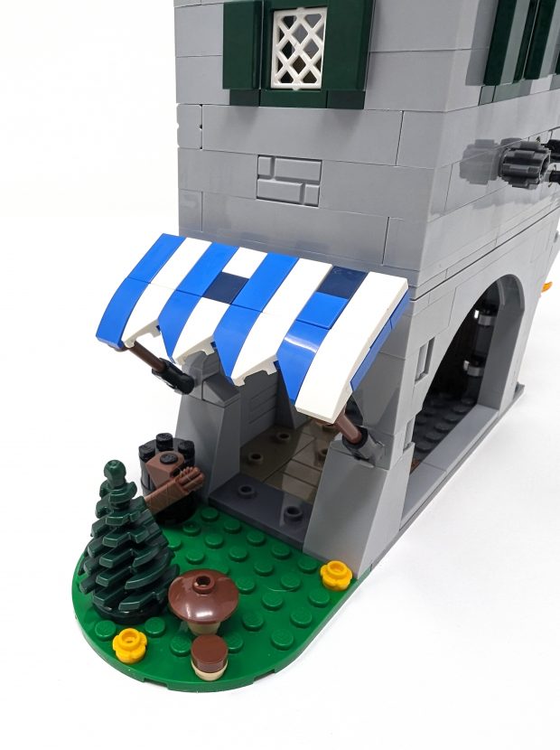 The canopy's colors contrast against the stony walls.