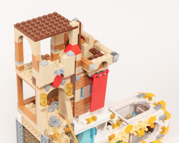 We attach a castle with red banners to the left side.