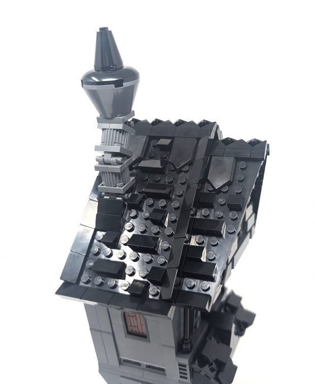 The roof is detailed with slopes and tiles to create a roof tile effect.