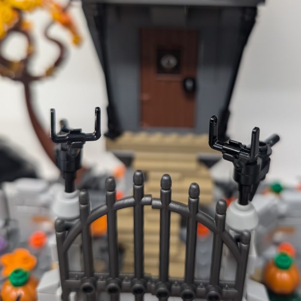 The post caps of the fence look like reindeer.