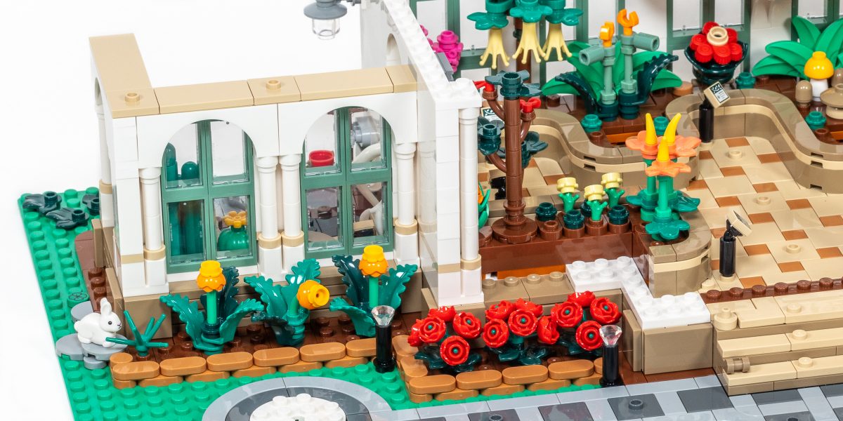 A bunny is munching on some of the flowers in the left bed.