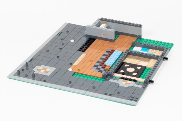 The interior has staggered wood flooring and there's a bathroom nestled underneath the staircase.