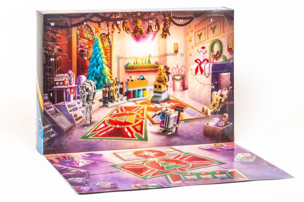The back side of each advent calendar folds down to reveal a building area and 24 numbered doors. (Star Wars shown here.)