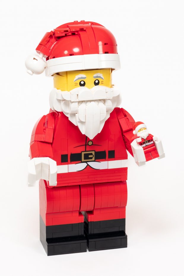 Brick-built Santa holding a Santa minifigure (not included).