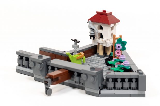 We add a fancy dovecote and decorative frieze in the final bag.