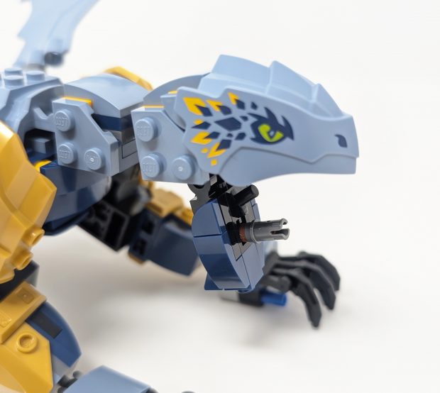 The dragon can wield weapons in its mouth.