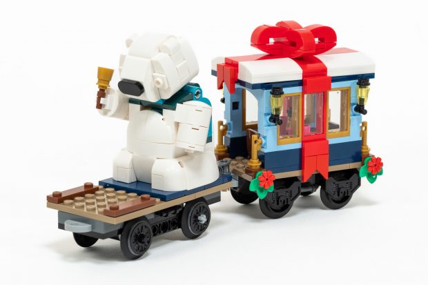 Flatbed Car with Polar Bear Statue, and Dining Car with Bow.