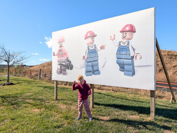Minifigure-themed billboard surrounding the complex. (7-year old for scale.)