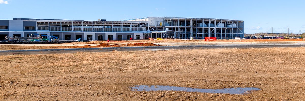 East-facing wall of the factory with the Varina-Enon Bridge behind it.