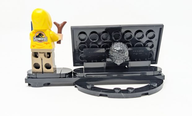 There is space to put his hair behind the plaque.